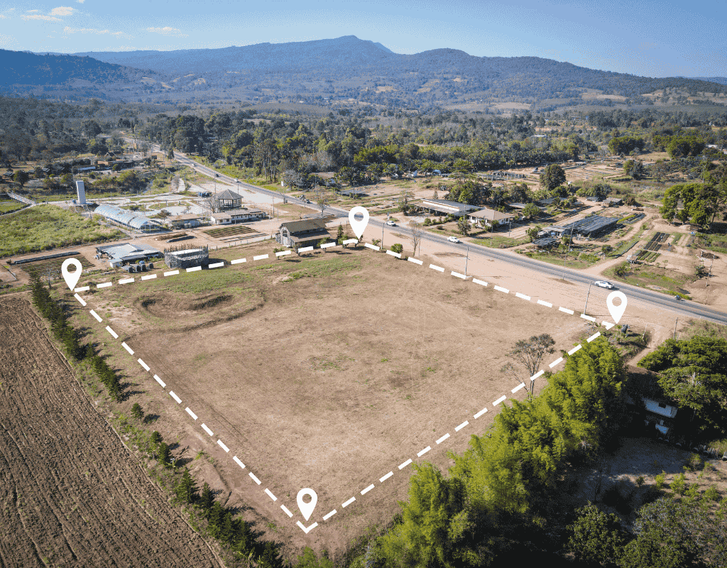 aerial view of cleared commercial land with marked boundaries in Wagoner County OK
