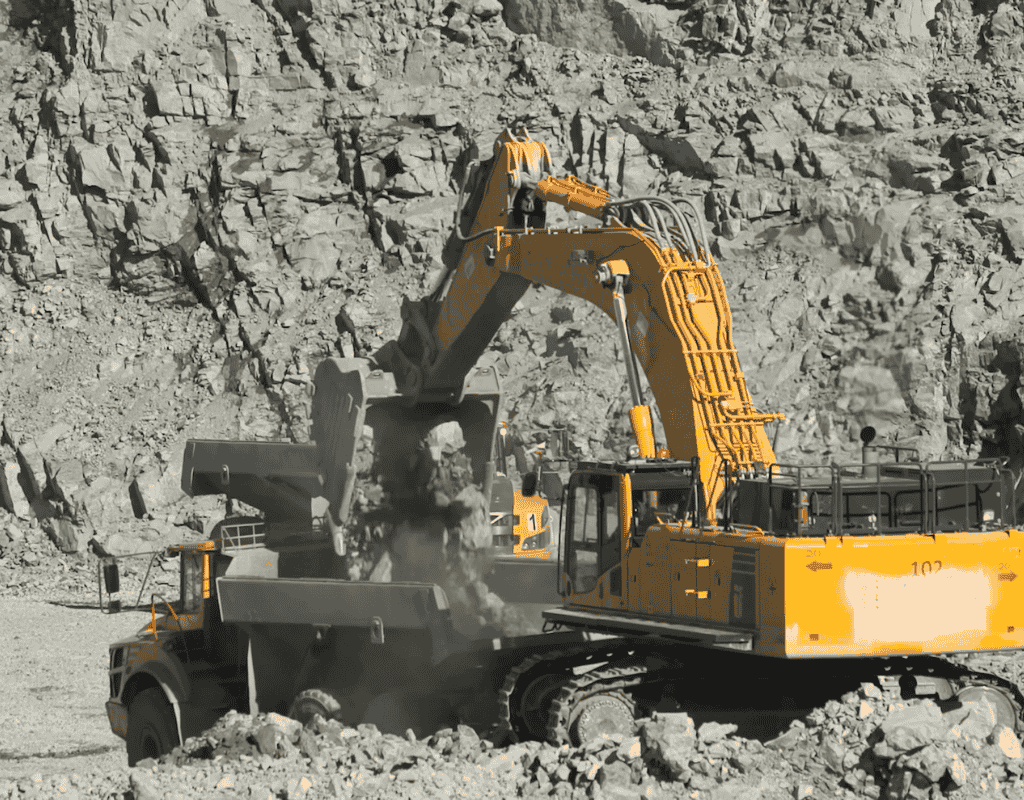 large excavator breaking and moving rock for site preparation in Wagoner County OK